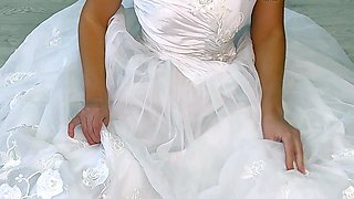 Backstage of a whore bride posing in a photo studio after