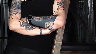 Slave Mila's Feet Dangle and Quiver as Mistress Baton Breaks in Heavy Wooden Paddle Over Her Jeans and Bare