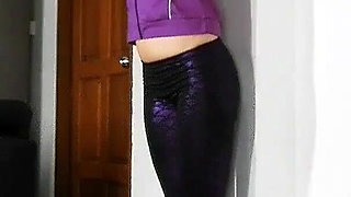Sensual Wall Stretching in Shiny Purple Leggings