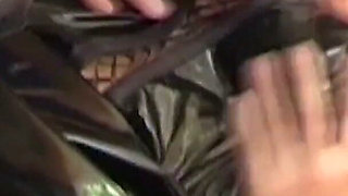 Blonde MILF in Raincoat Sucks Plastic Wrapped Cock