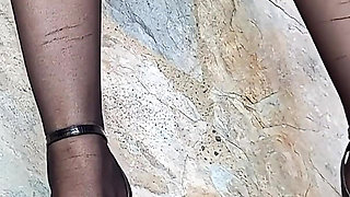 In Front of You the Secretary with Pantyhose and Stiletto Heels Dangling From Her Feet