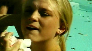 Perfect blonde babe gets a facial after outdoor fuck by the pool