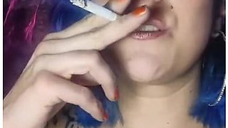 Close-up lips wrapped around a cigarette, smoke curling in the air