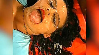 Bukkake Slut with Glasses Gets Her Face Drenched in Cum