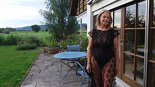 A Mature Woman Shows off Her Figure Outside in a Lace Bodysuit!