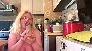 Horny stepmom in latex heels surprises stepson with huge dildo and dirty talk in kitchen