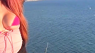 Artemisia Love Wearing Sexy Clothes and Smoking and Flashing Her Big Juicy Boobs in a Perfect Place by the Ocean
