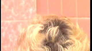 Hairy MILF slut masturbates under shower