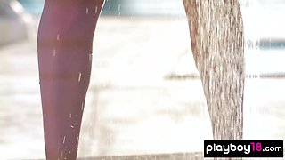 Nude teenage poses under the shower outdoor