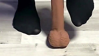 Sexy Dominatrix in Nylon Pantyhose Is Trampling Your Cock