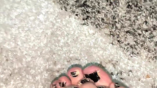 Playing with my feet with a body oil and cream