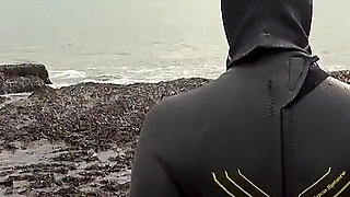 Rubbery Beach Encounter: Lucy's Neoprene Pussy Play with Stranger