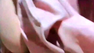 Alone in the house, a woman is calming her pussy with eggplant