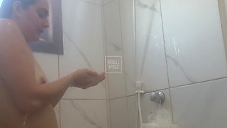 Naughty aunt makes naked call during shower