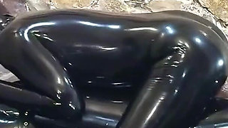 Rubber Slave Is Used Sexually