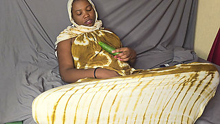 Hijab Fucking Herself Using Big Cucumber with Condom to Slide Into the Pussy