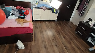 Amateur woman has fun trying on clothes and cutting them.