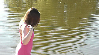 Beautiful Cute Girl Assol Sunbathes on River Bank on Wild Beach in a Dress Without Panties and Naked in Public Outdoors Outside