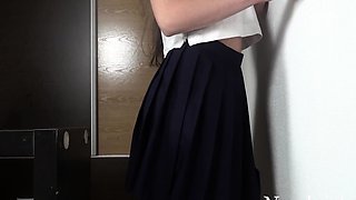 Japanese girl rubs against the wall with great pleasure and