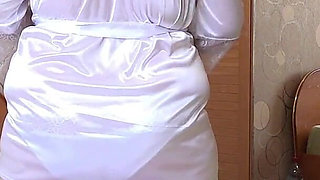 A Busty MILF with a Big Ass in White Panties Behind the Scenes. a Home Camera Watches a Mature Housewife. PAWG.