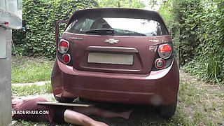 Mistress Jenna Stands on the Slave with a Car While Smoking in the Slave's Mouth
